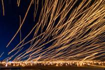 People release lanterns as a group during the RiSE Lantern Fest at the Jean Dry Lake Bed on Fri ...