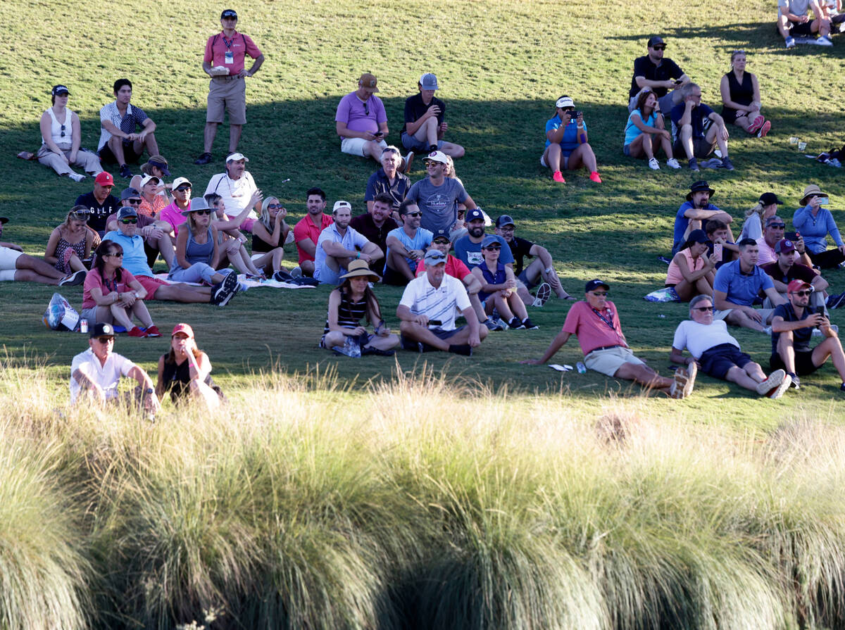 Fans watch the third round of the Shriners Children's Open tournament at TPC at Summerlin in La ...