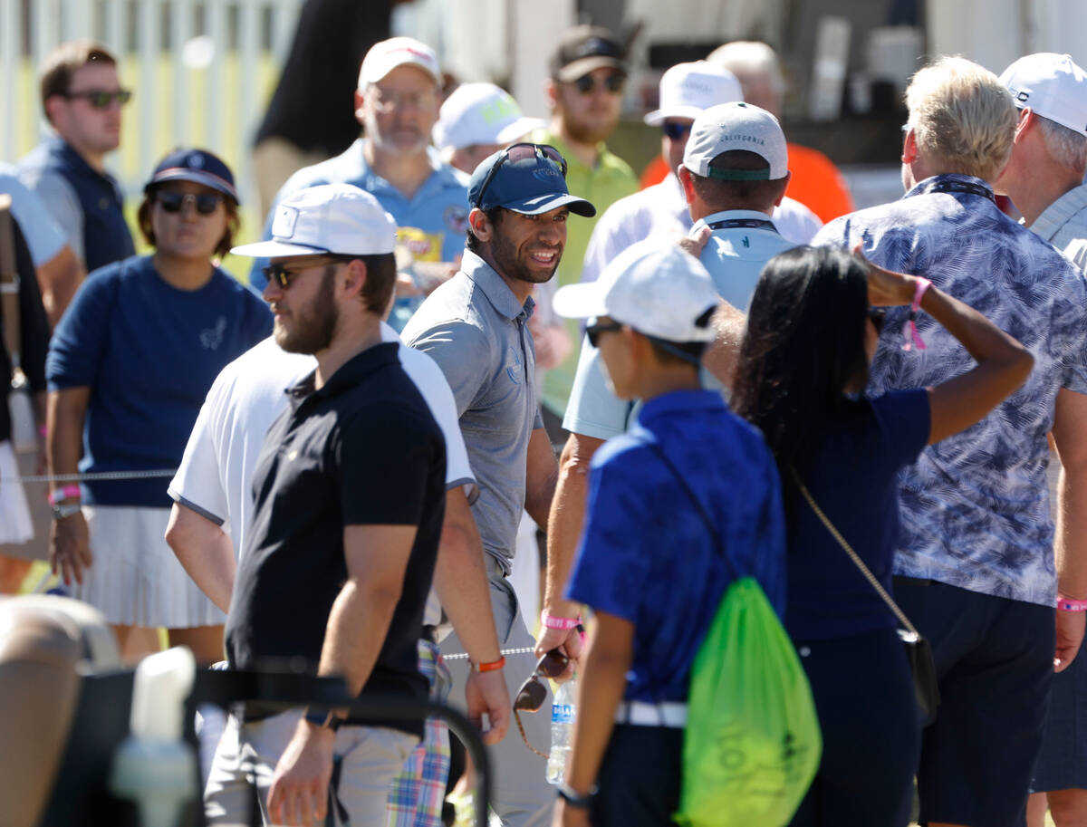 Aaron Rai, center, greets fans after the third round of the Shriners Children's Open tournament ...