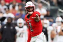 FILE - UNLV Rebels quarterback Doug Brumfield (2) gets ready to snap the ball during the first ...