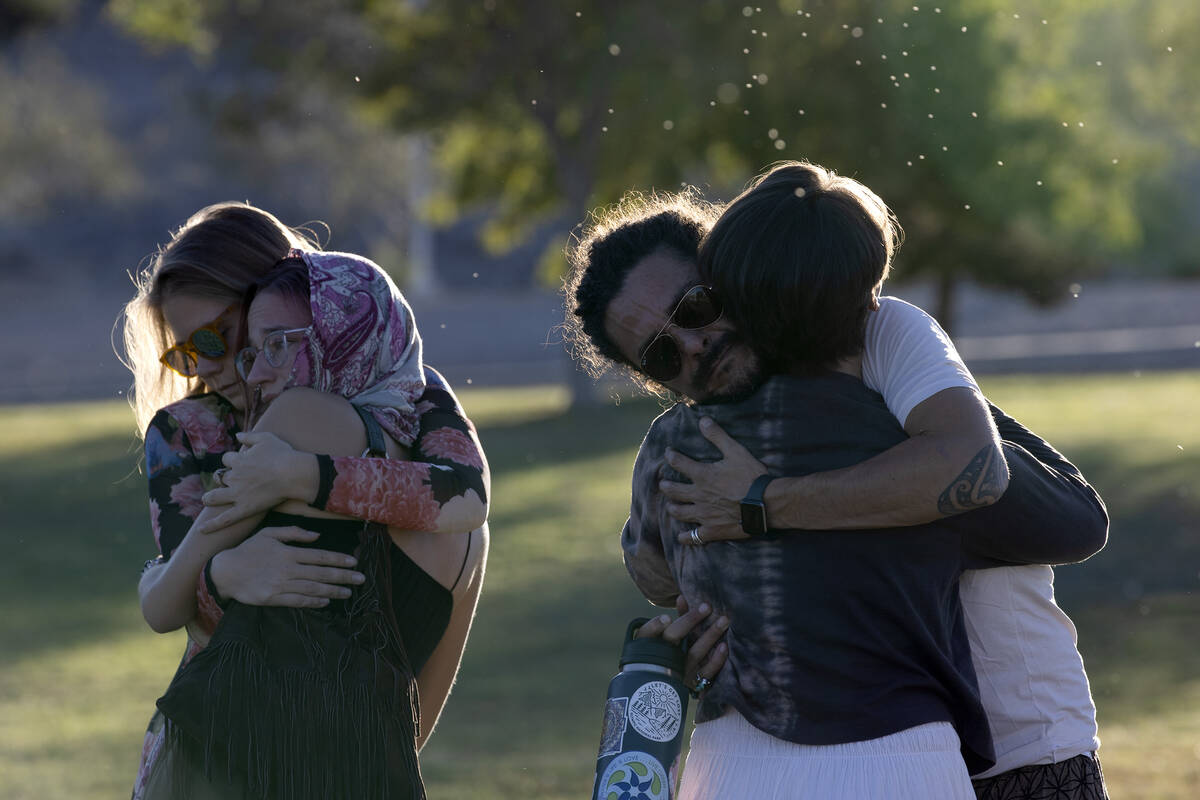 Loved ones greet each other with hugs during a vigil held for Las Vegas Strip stabbing victim M ...
