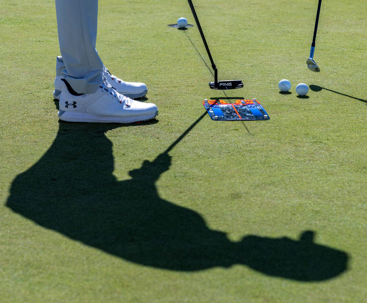 A player warms up on the putting green during the final day of play in the Shriners Children's ...