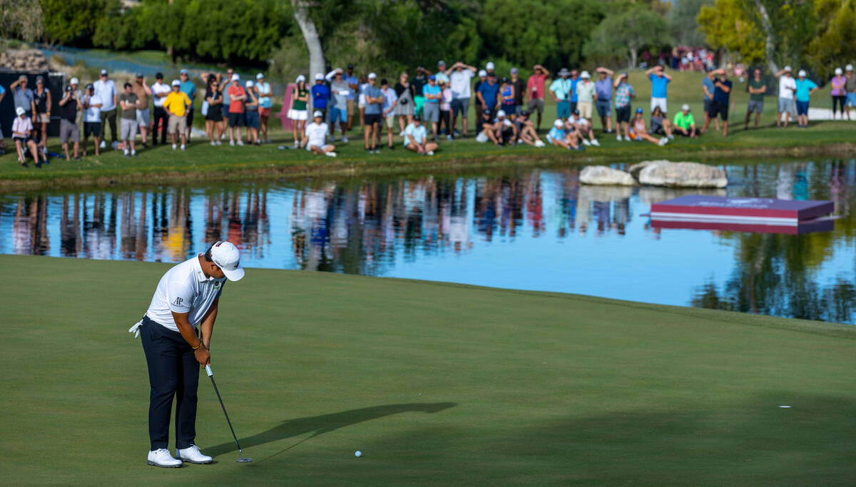 Tom Kim looks tom sink a long putt for the win on the 18th green during the final day of play i ...