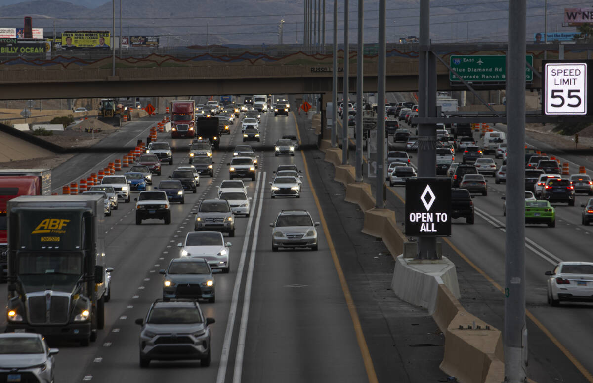 An HOV lane sign denotes that the lane is "open to all" as part of a pilot transporta ...