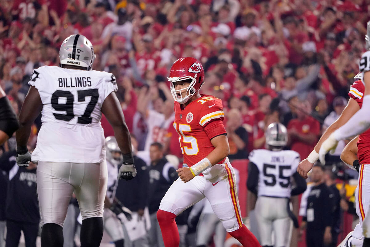 Kansas City Chiefs quarterback Patrick Mahomes (15) celebrates after throwing a touchdown pass ...