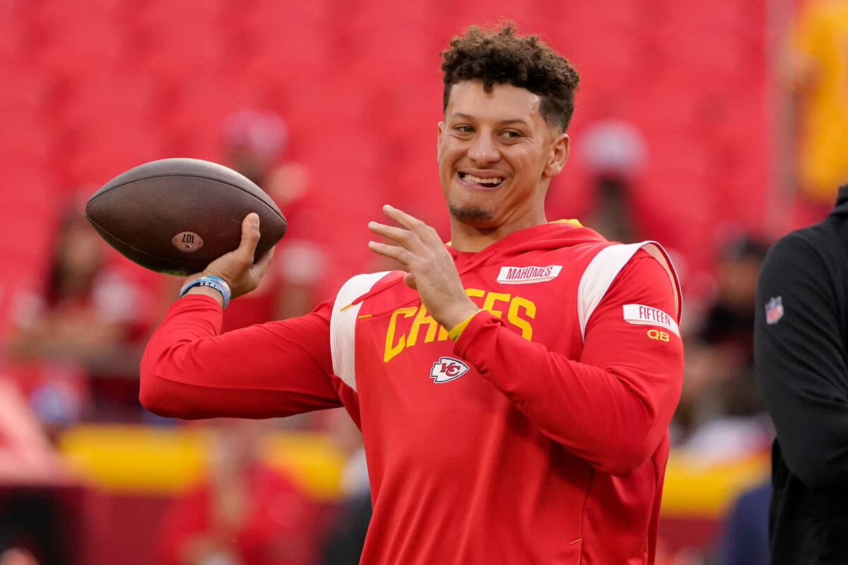 Kansas City Chiefs quarterback Patrick Mahomes warms up before the start of an NFL football gam ...