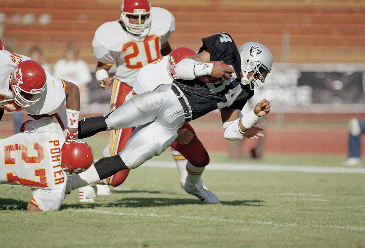 Los Angeles Raiders running back Bo Jackson goes for maximum yardage in the second quarter in g ...