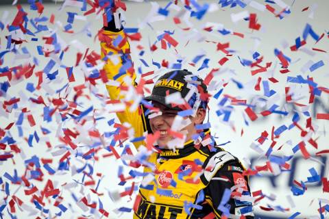 Christopher Bell celebrates in Victory Lane after winning a NASCAR Cup Series auto race at Char ...