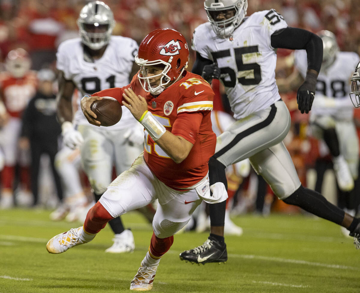 Kansas City Chiefs quarterback Patrick Mahomes (15) scrambles during the second half of an NFL ...