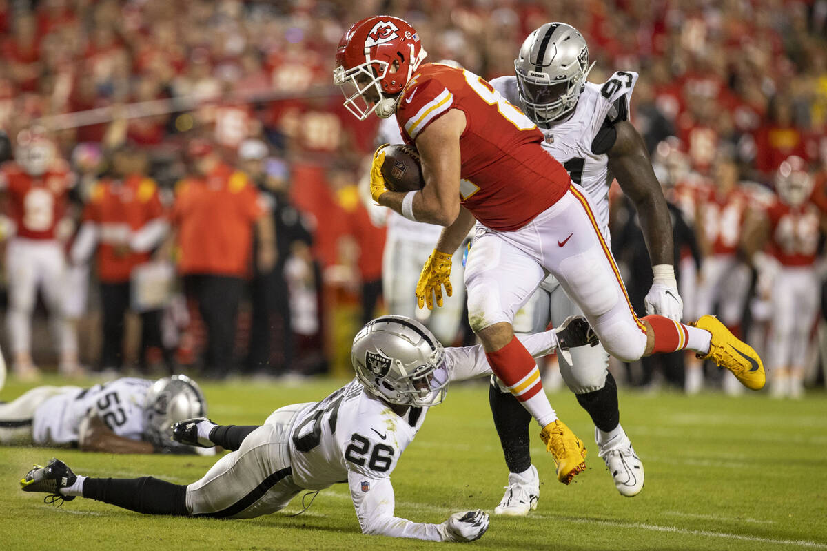 Raiders cornerback Rock Ya-Sin (26) reaches out to try and tackle Kansas City Chiefs tight end ...