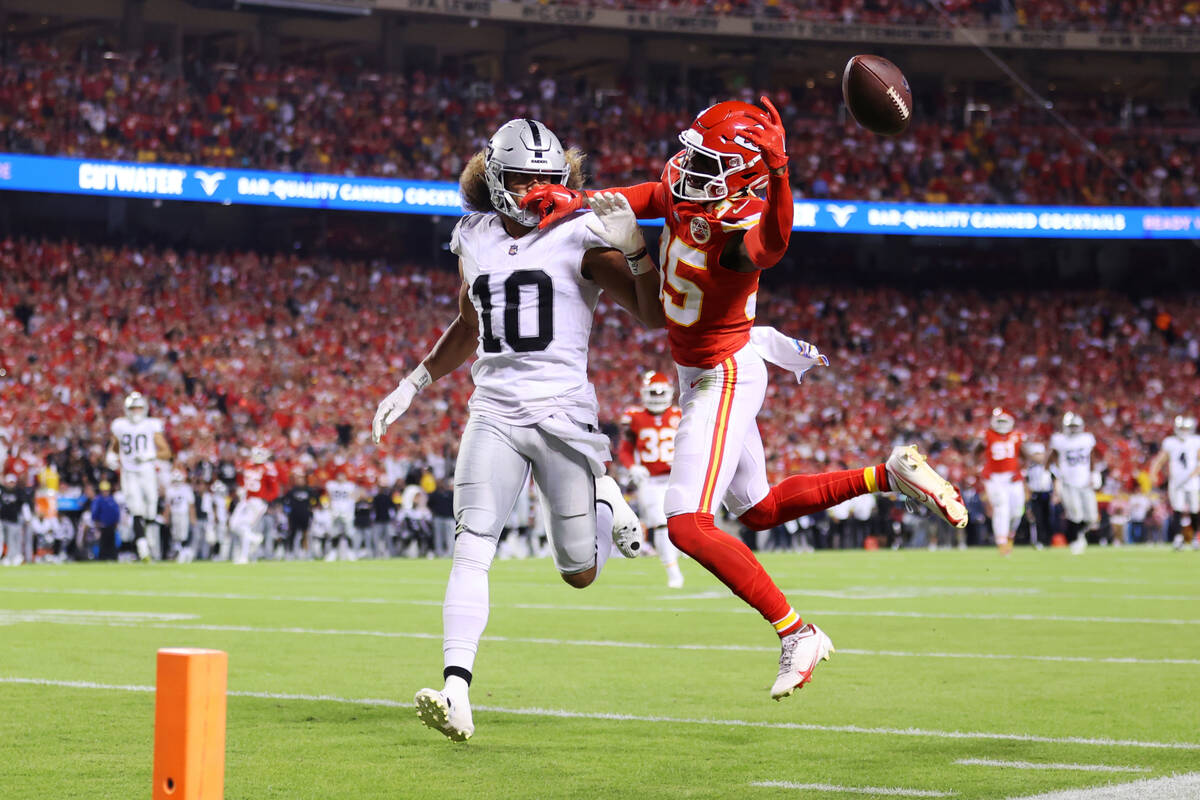 Raiders wide receiver Mack Hollins (10) defends a pass intended for Kansas City Chiefs cornerba ...