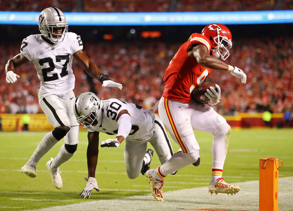 Kansas City Chiefs wide receiver JuJu Smith-Schuster (9) is forces out of bounds by Raiders saf ...