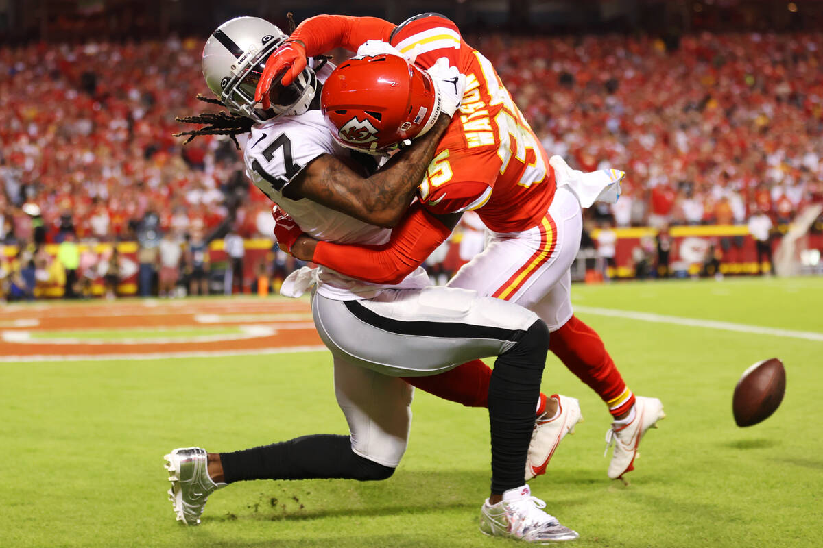 Kansas City Chiefs cornerback Jaylen Watson (35) defends a pass intended for Raiders wide recei ...