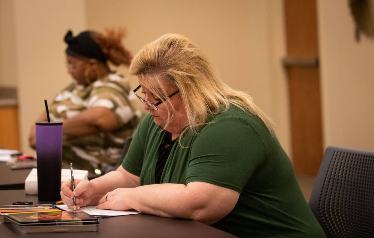 Participant Jackie Heier works on her coloring activity during an Adult Coloring and Journaling ...