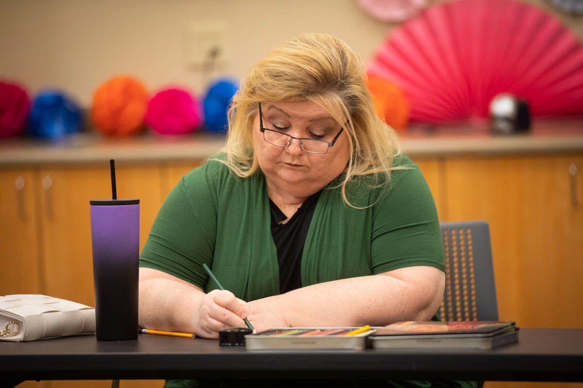 Participant Jackie Heier works on her coloring activity during an Adult Coloring and Journaling ...