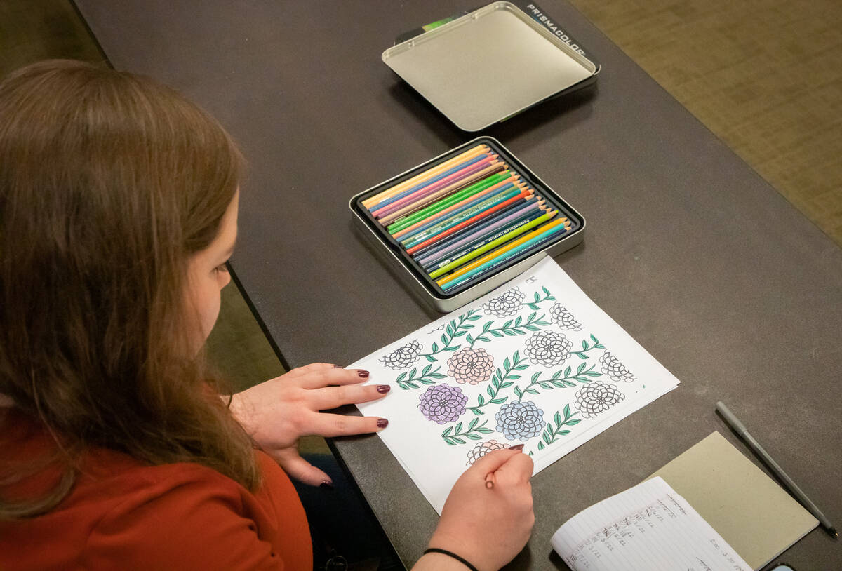 Sharie Heier, multiservice assistant and facilitator, colors during an Adult Coloring and Journ ...