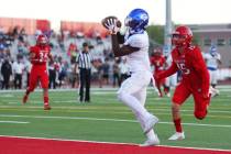 Bishop Gorman's Zachariah Branch (1) makes a touchdown catch under pressure from Arbor View's T ...