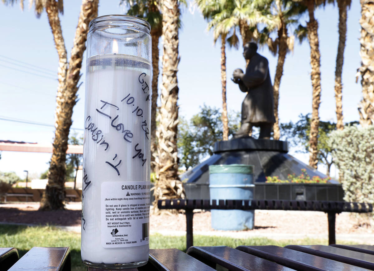 A candle with "I Love You Cousin" message is placed on Wednesday, Oct. 5, 2022, where ...