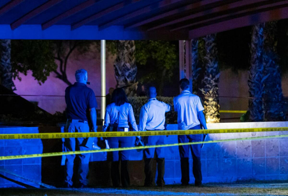 North Las Vegas police investigate the scene of an officer-involved shooting at Martin Luther K ...