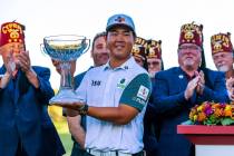 Tom Kim holds up his winning trophy during the final day of play in the Shriners Children's Ope ...