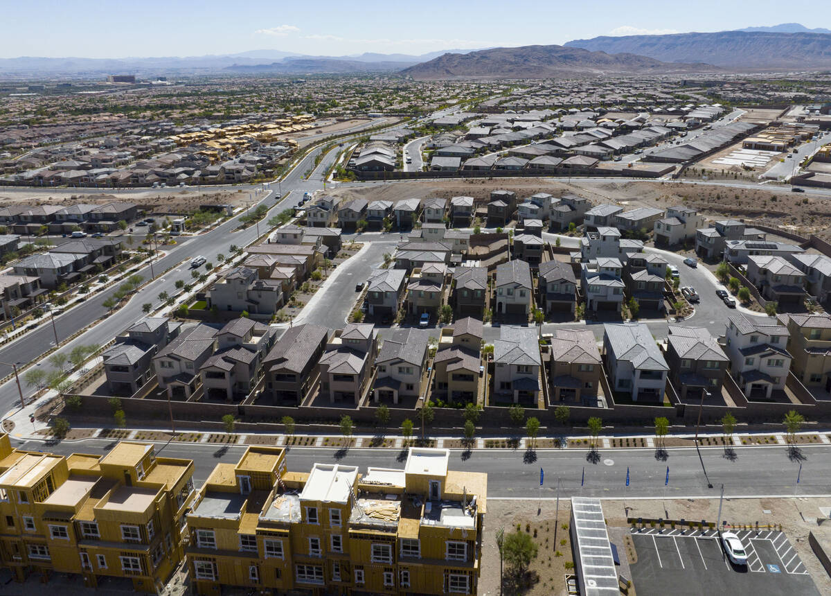 Construction is underway for new development as existing homes are seen from Desert Foothills D ...