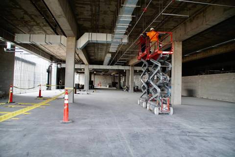 Construction workers prepare the ceiling to install tiles. (Centennial Subaru)