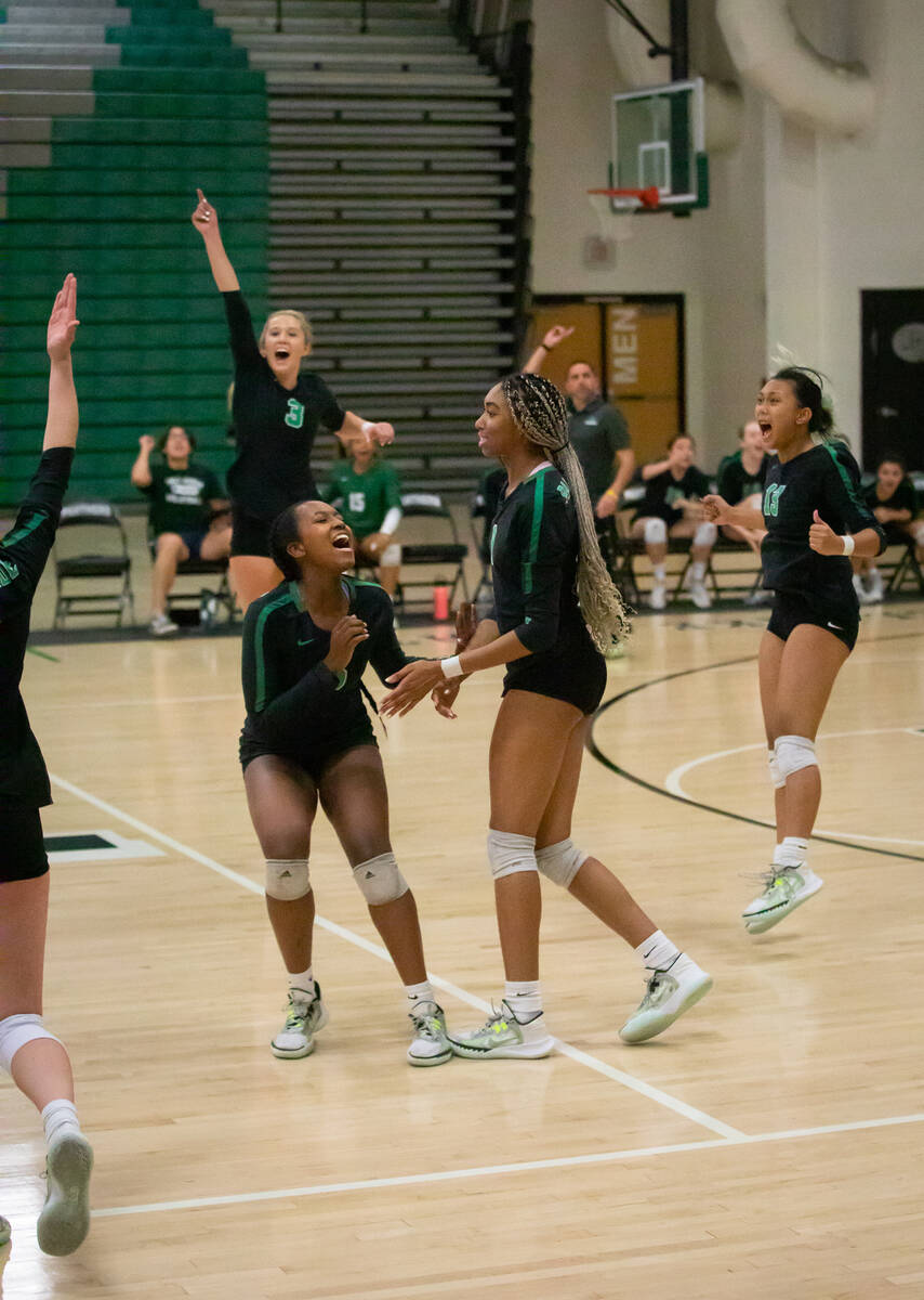 Palo Verde team members cheer after winning the Green Valley-Palo Verde girls volleyball match ...