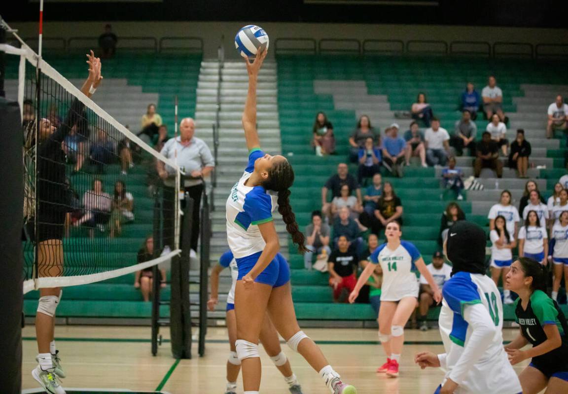 Green Valley’s Aby Tibesar-Magassa (8) blocks the ball during a girls volleyball match a ...