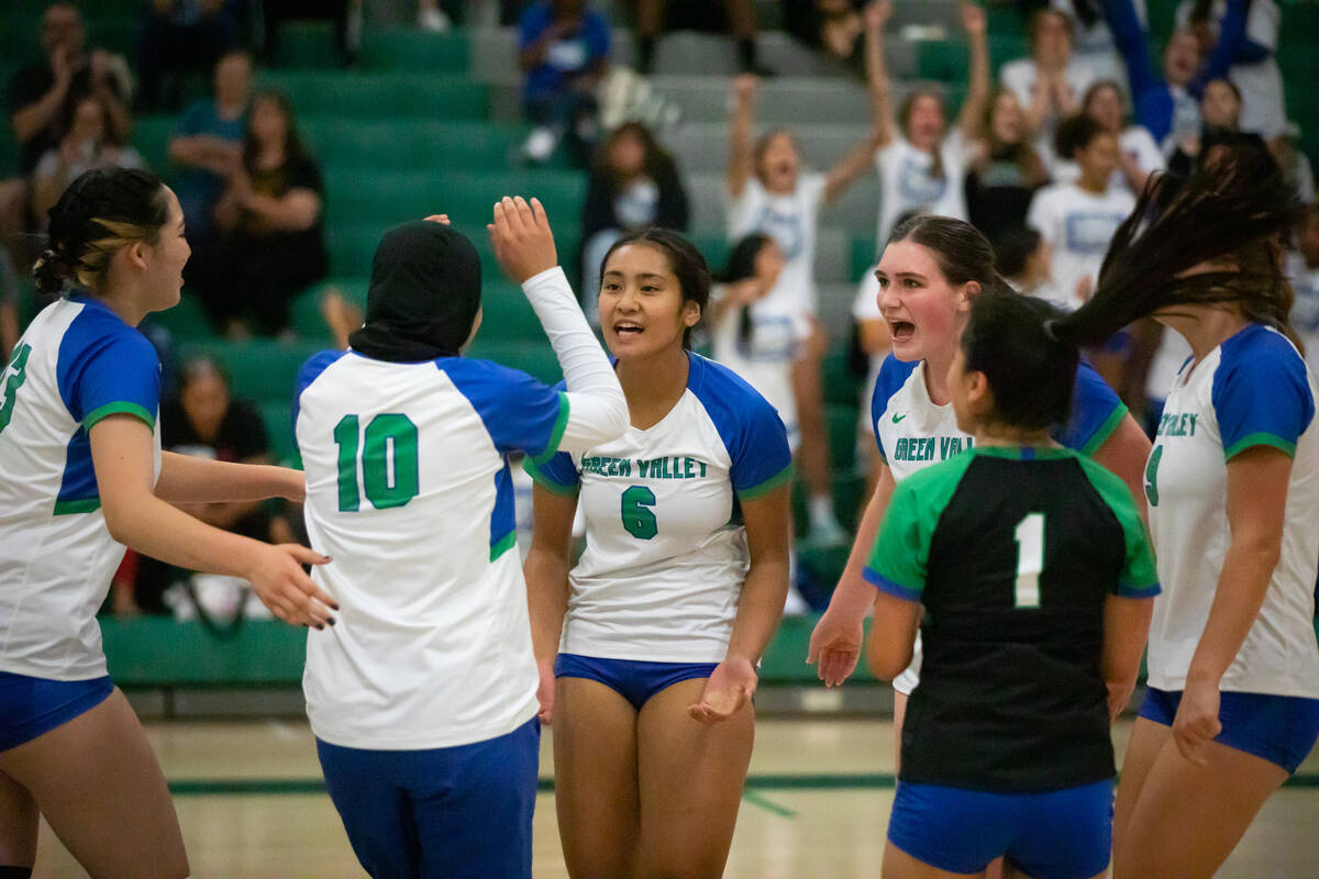 Green Valley’s Ensilina Savelio (6) cheers with her team mates during a volleyball game ...