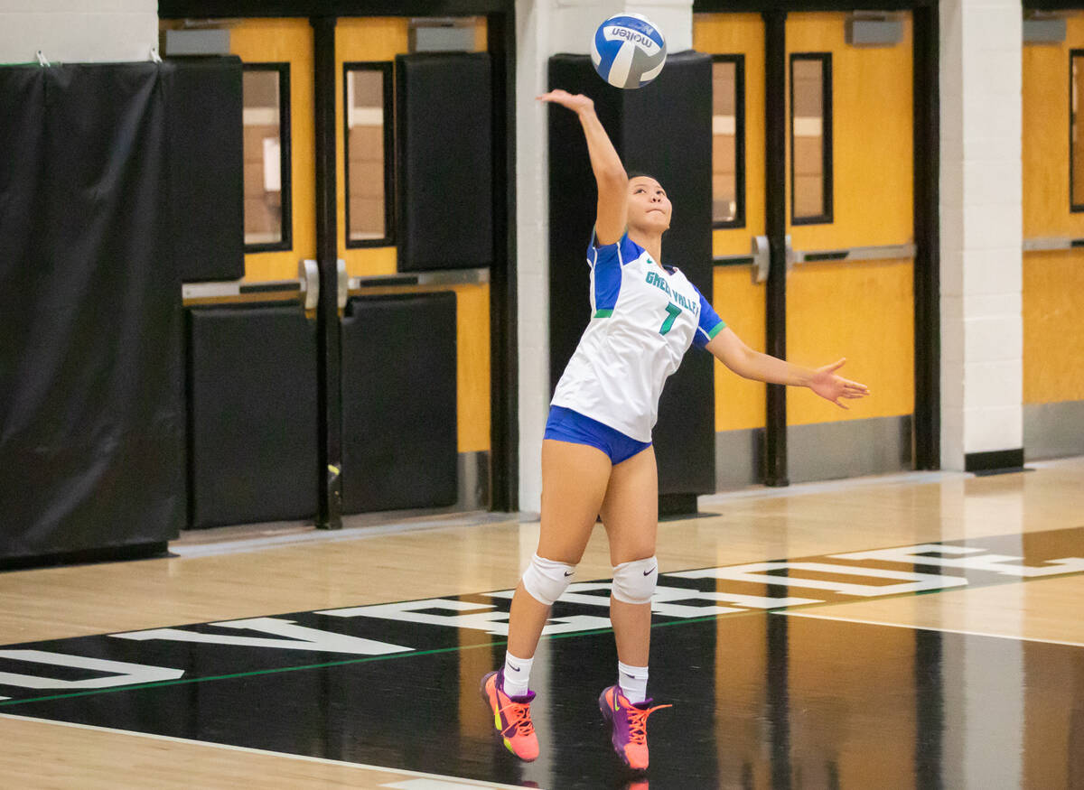 Green Valley’s Faith Arriola (7) serves the ball during a volleyball game at Palo Verde ...
