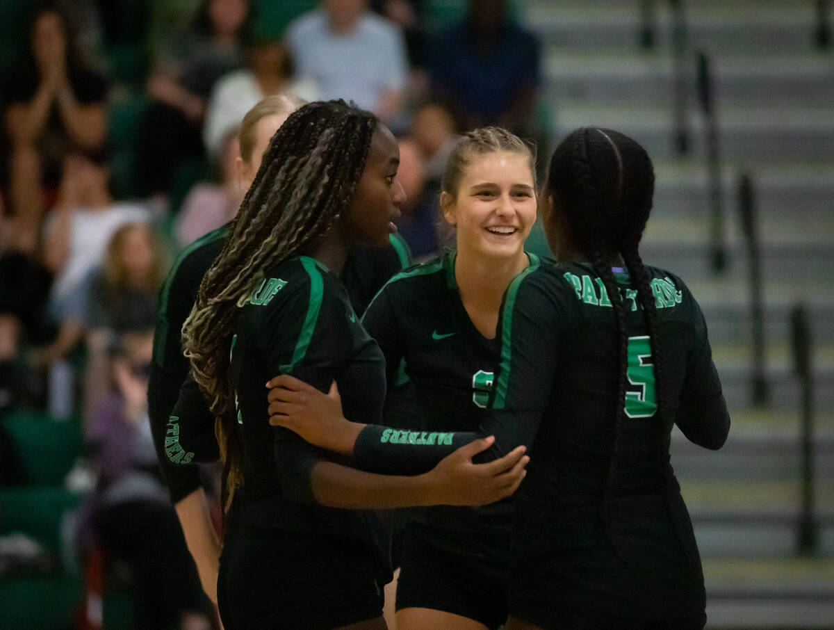 Palo Verde teammates embrace during a volleyball game at Palo Verde high school on Tuesday, Oct ...