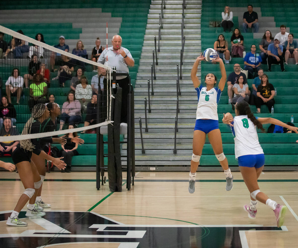 Green Valley’s Ensilina Savelio (6) sets the ball during a volleyball game at Palo Verde ...