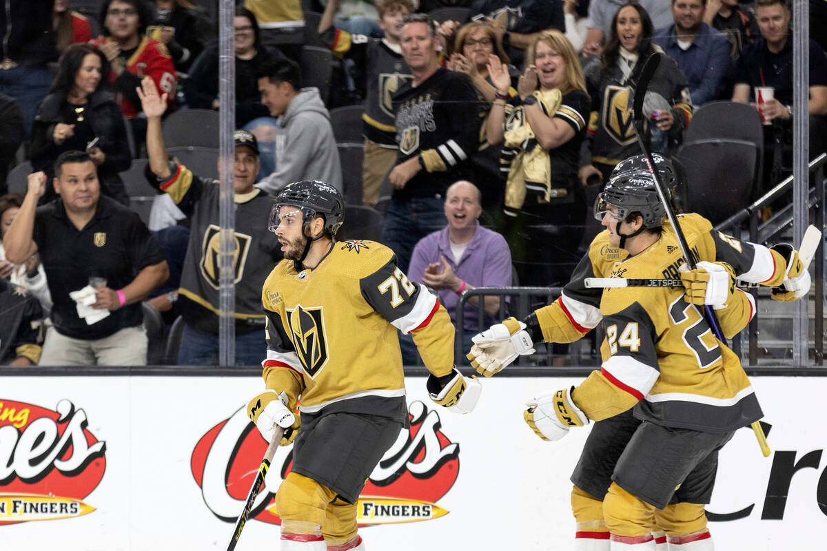 Fans cheer for Golden Knights forward Gage Quinney (72) while he skates off the ice after he sc ...