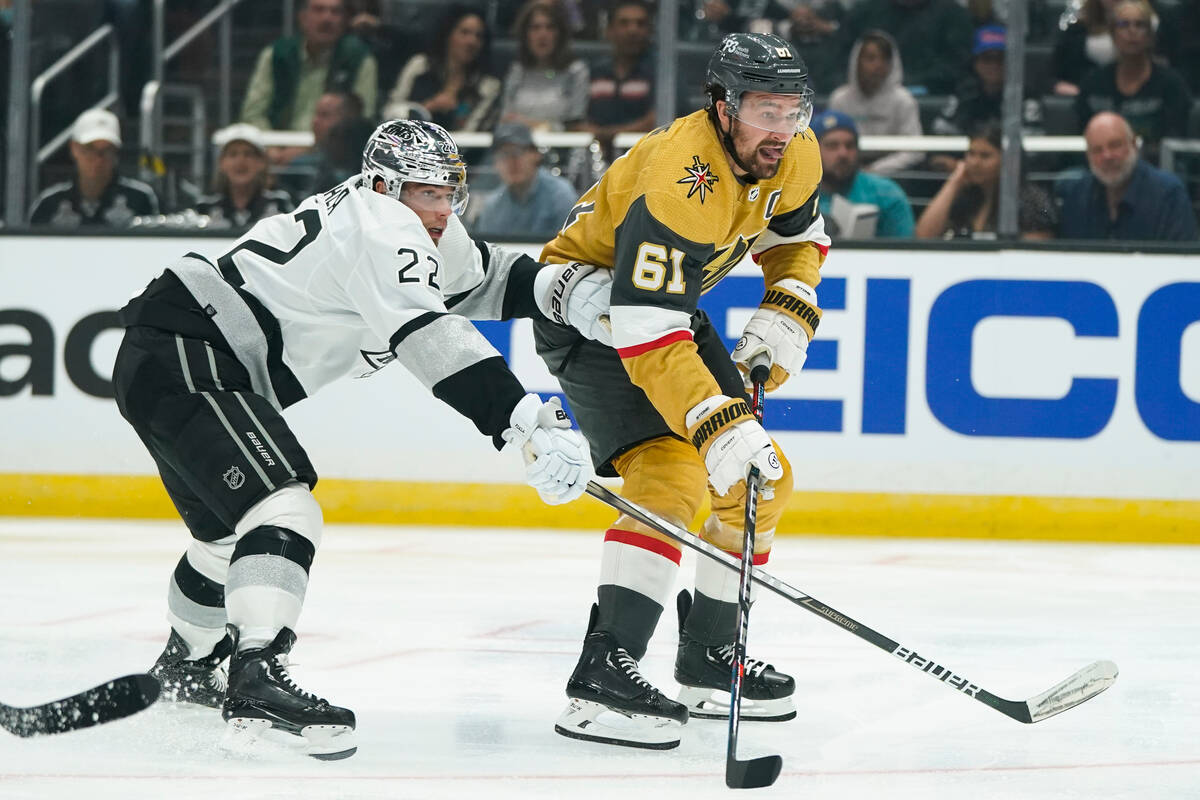 Vegas Golden Knights' Mark Stone, right, looks to shoot as he is defended by Los Angeles Kings' ...