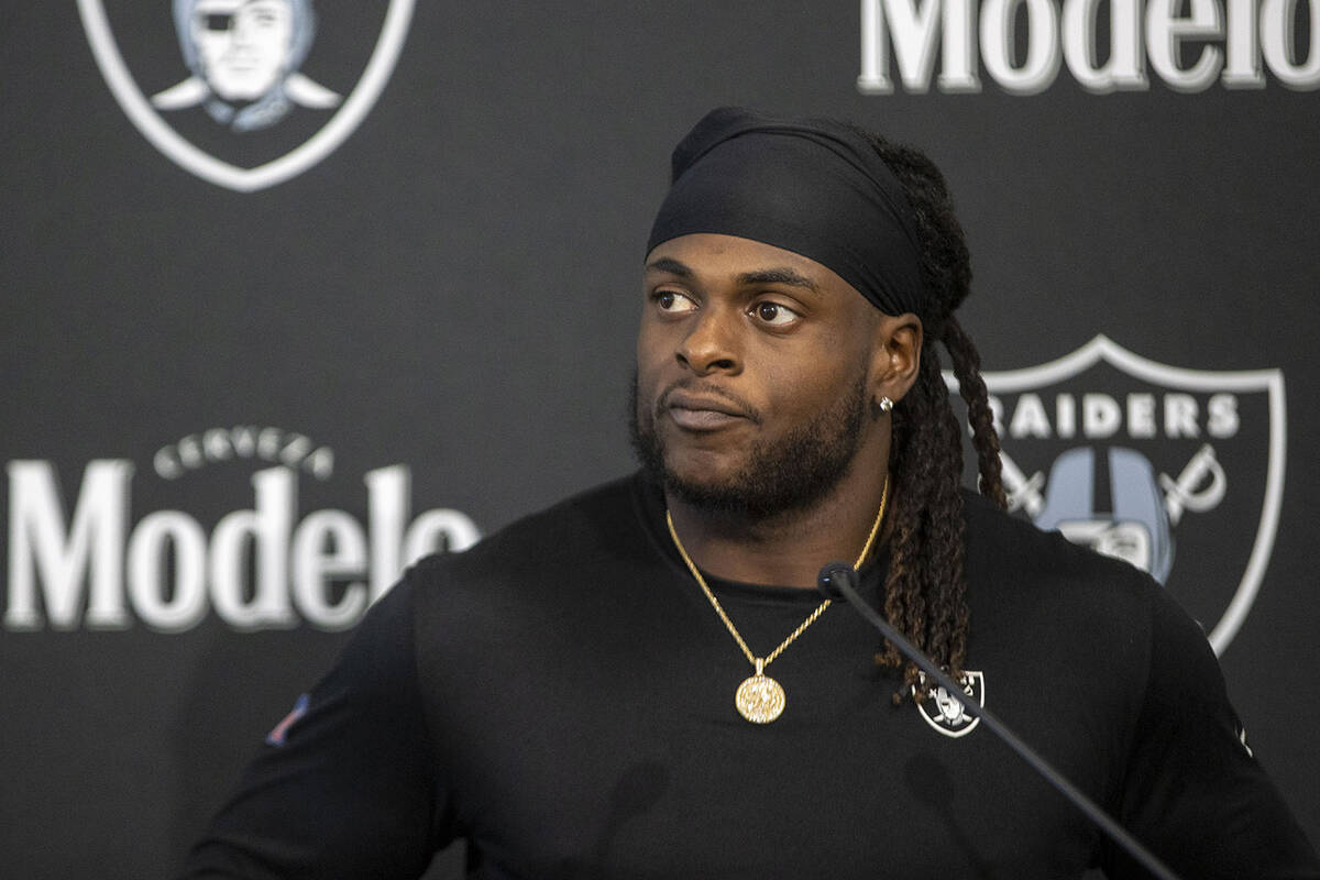 Raiders wide receiver Davante Adams reacts to a question during a news conference at the Interm ...