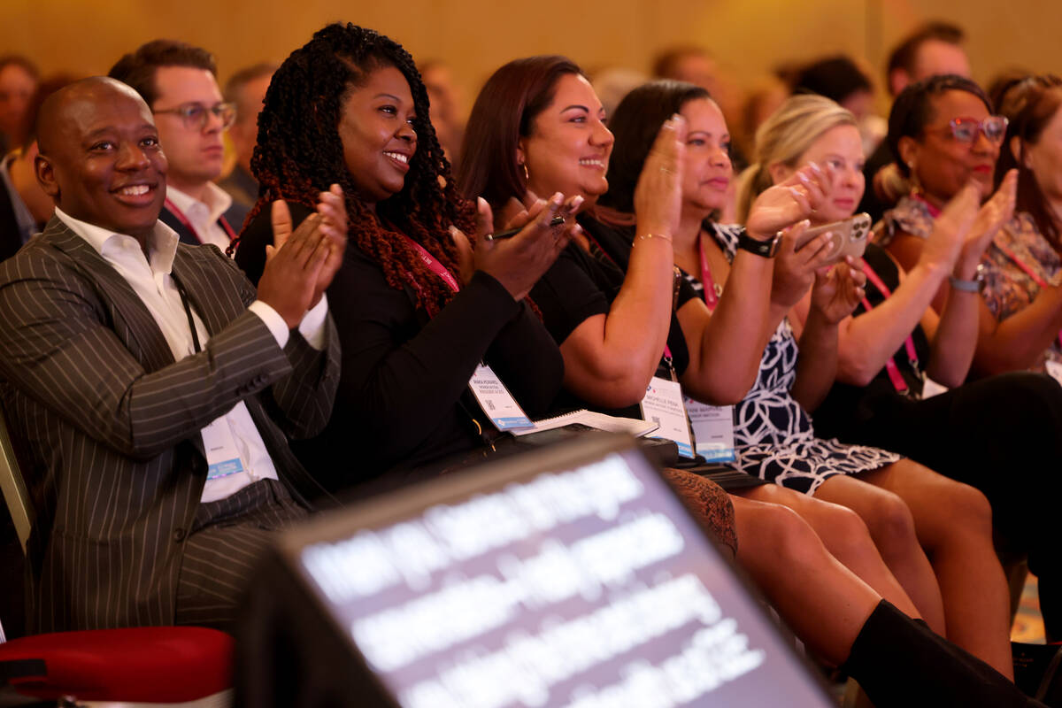 Audience members applaud as Raiders President Sandra Douglass Morgan talks to American Gaming A ...