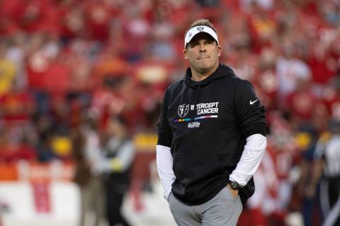 Raiders head coach Josh McDaniels walks to the team’s sideline before an NFL game agains ...