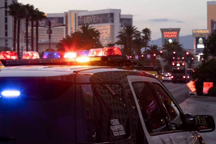 Metropolitan police patrol the Las Vegas Strip outside of Planet Hollywood on Tuesday, Aug. 2, ...