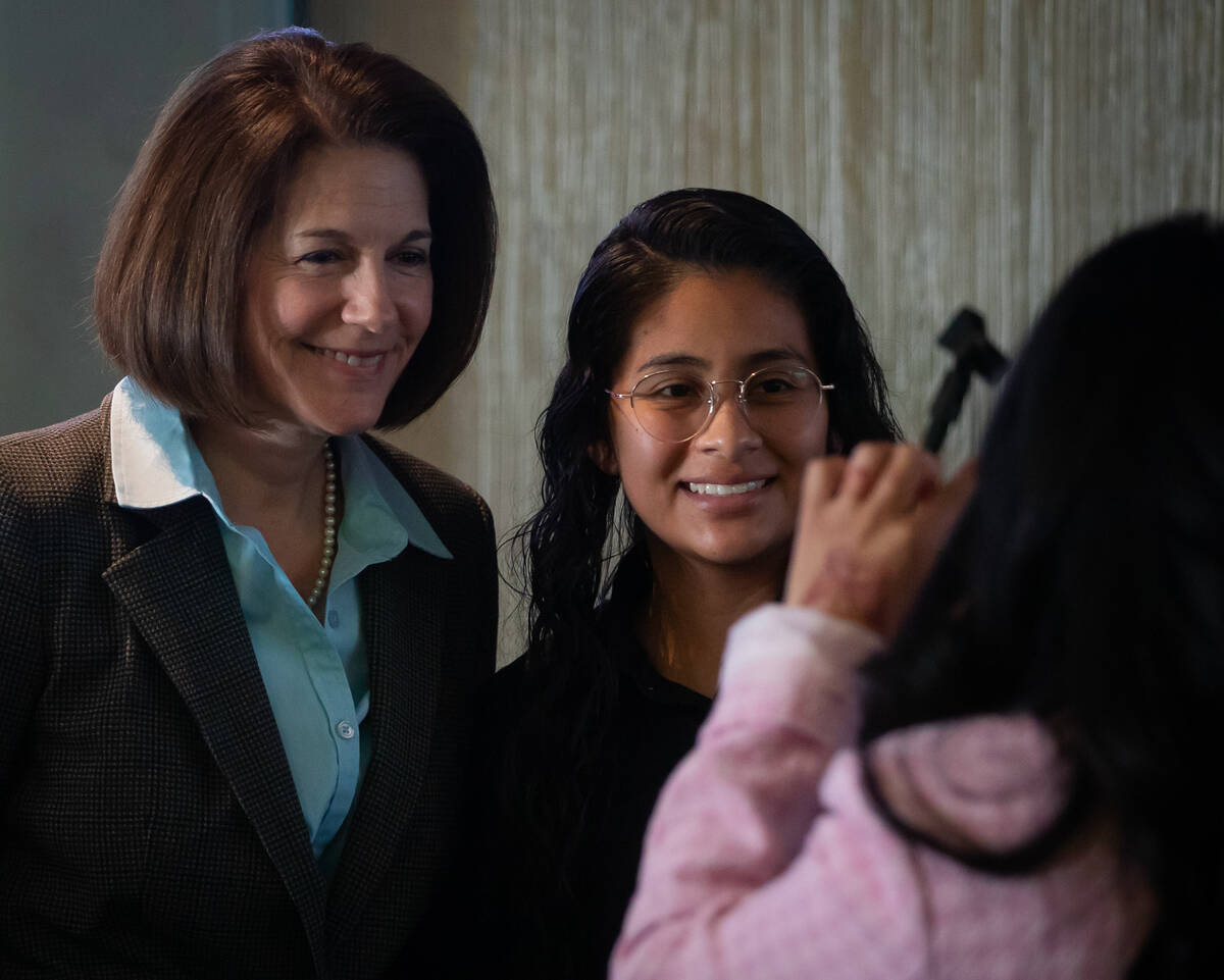 Sen. Catherine Cortez Masto, D-Nev., poses for photos with Iris Varga after a round table discu ...