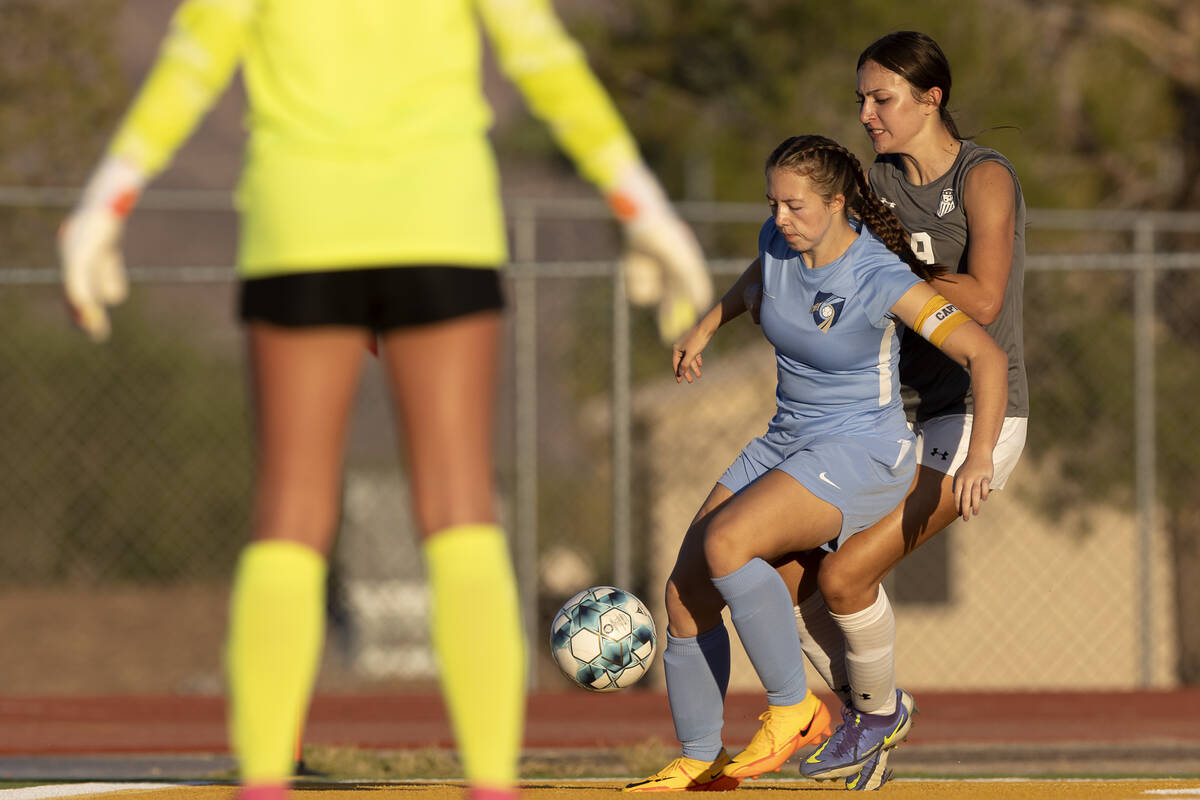 Foothill’s Madison Small, center, retrieves the ball from going out of bounds while Arbo ...