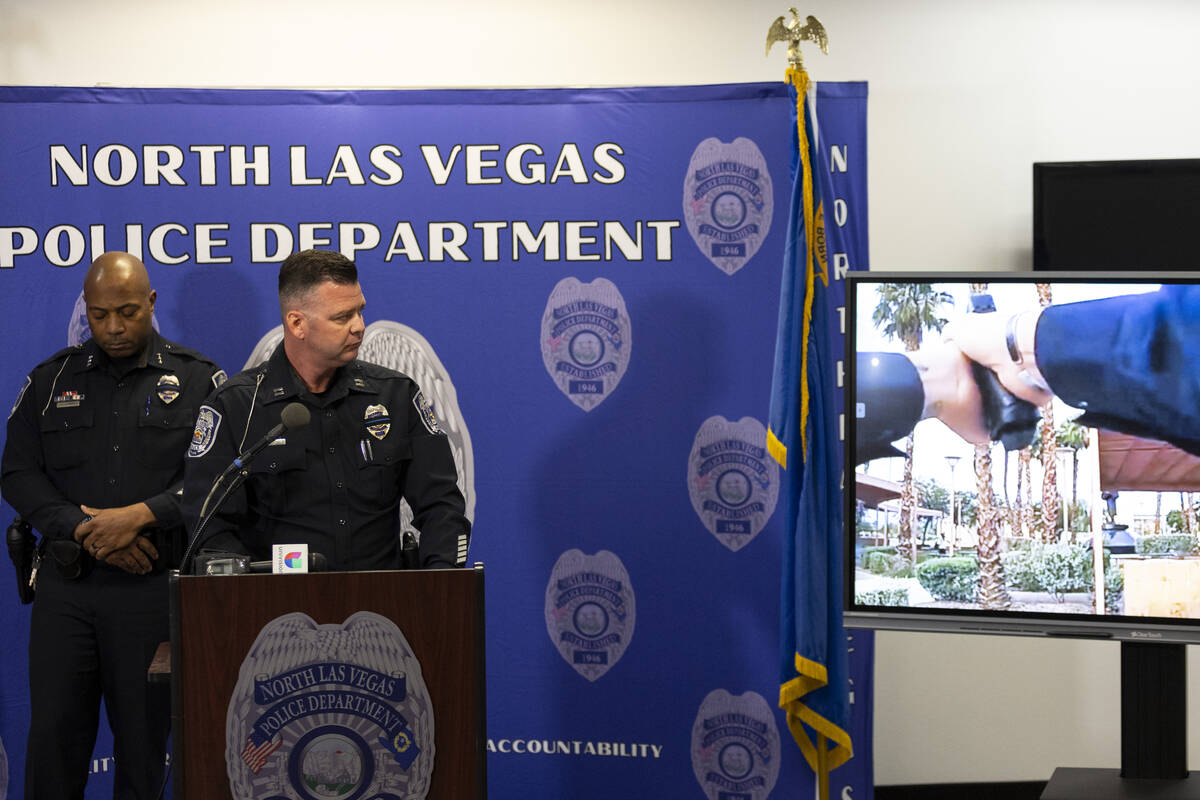 Captain Adam Hyde, right, with Assistant Chief Michael Harris, speaks on an officer involved sh ...