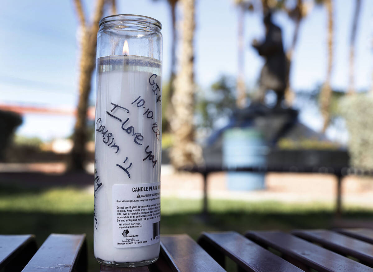 A candle with "I Love You Cousin" message is placed on Wednesday, Oct. 5, 2022, where ...