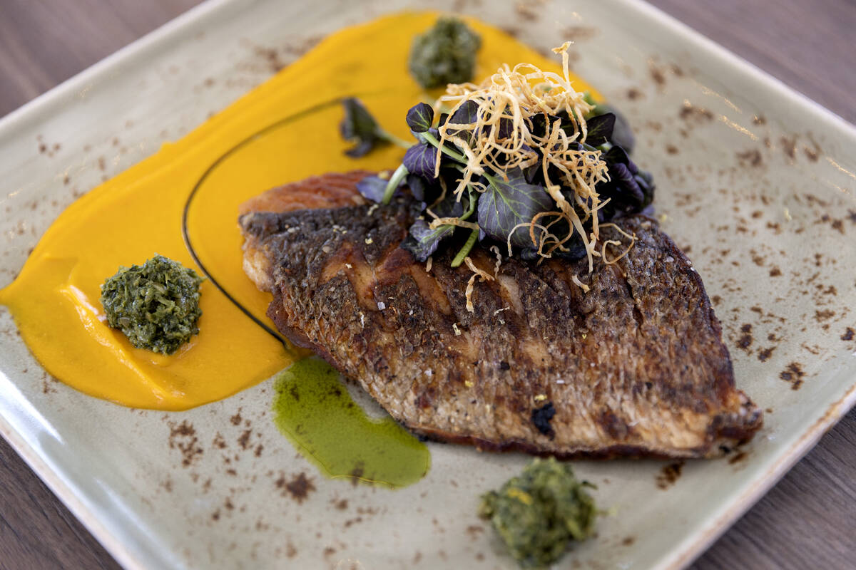 Honey Salt’s striped bass with carrot puree, pumpkin seed pesto and watercress at the re ...
