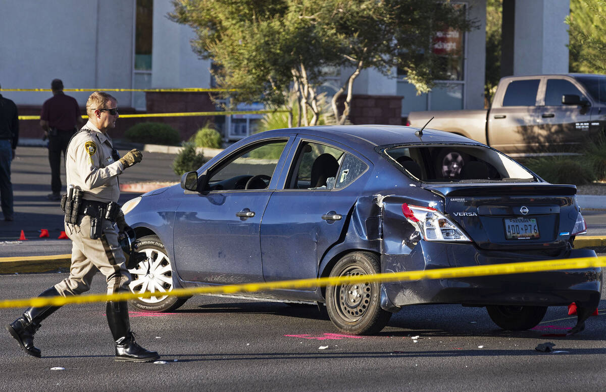 Las Vegas police investigate a suspect's vehicle at around 2400 block of East Desert Inn Road a ...