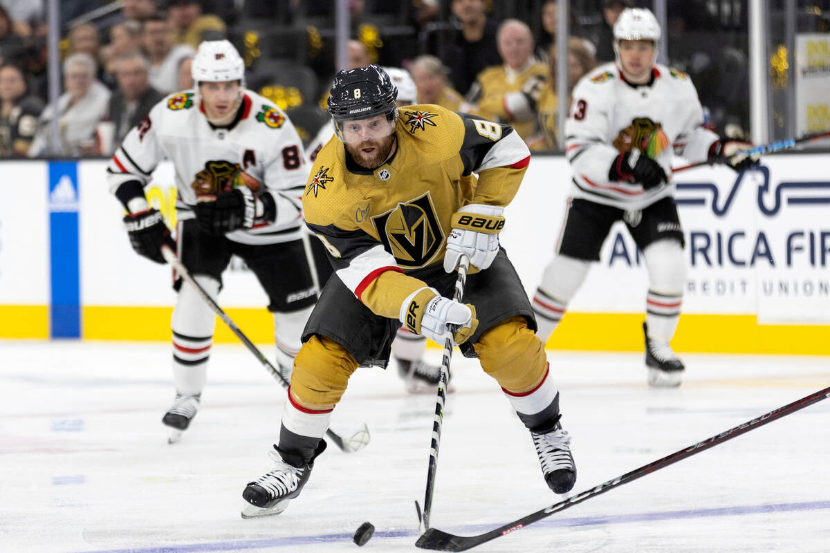 Golden Knights center Phil Kessel (8) receives a pass intended for the Blackhawks during the fi ...