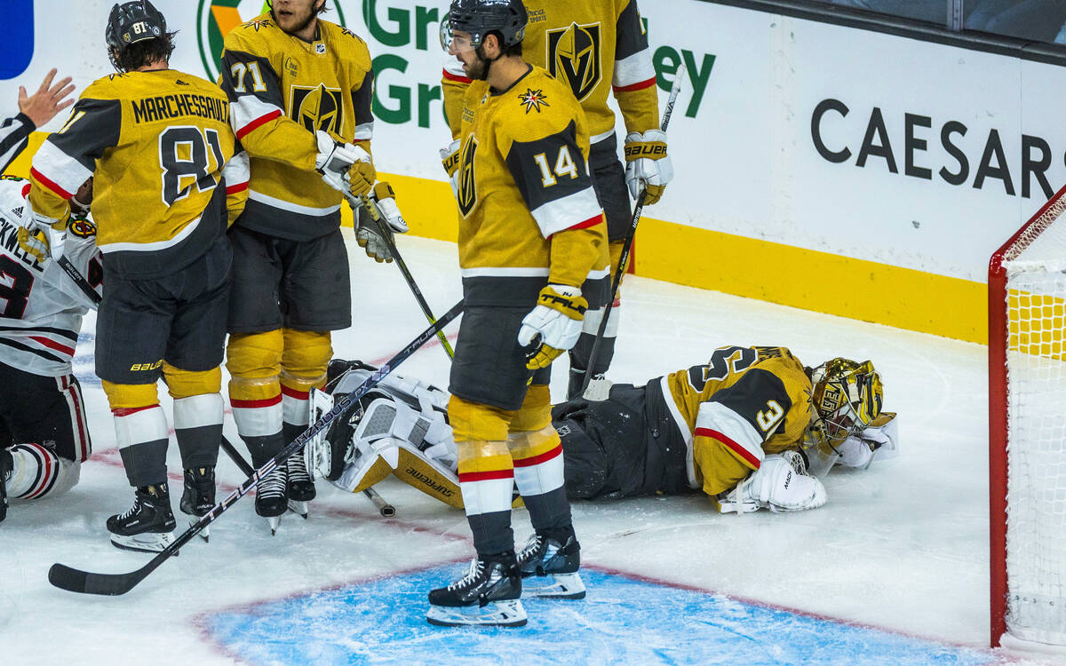 Golden Knights goaltender Logan Thompson (36) is a bit shaken up after colliding with a Chicago ...