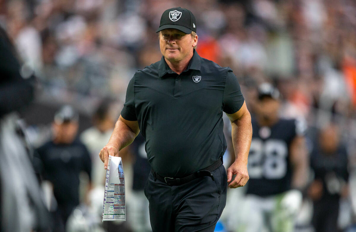 Then-Raiders head coach Jon Gruden runs off the field for halftime during an NFL football game ...