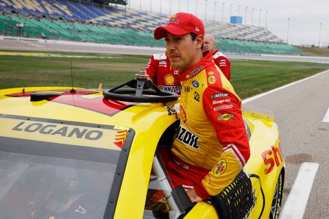 Joey Logano enters his car as he prepares for qualifying to begin for a NASCAR Cup Series auto ...