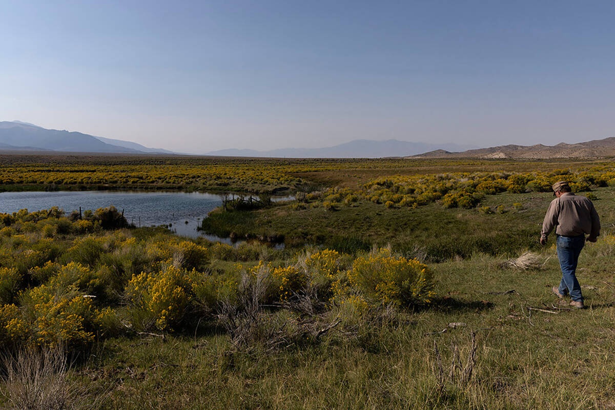 Rancher Tom Baker walks around a pond on his ranch on Friday, Sept. 9, 2022, in Garrison, Utah. ...