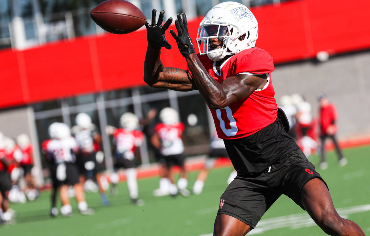 UNLV wide receiver Senika McKie reaches for a reception during football practice on Wednesday, ...